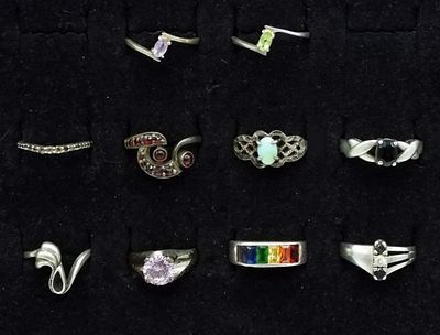 10 Sterling Multi Gemstone Rings. Collection of 10 marked sterling silver rings featuring opal 