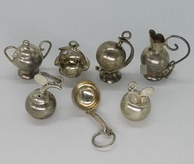 7 Sterling Silver Miniature Tea Set Charms. Collection of seven sterling silver miniature tea 