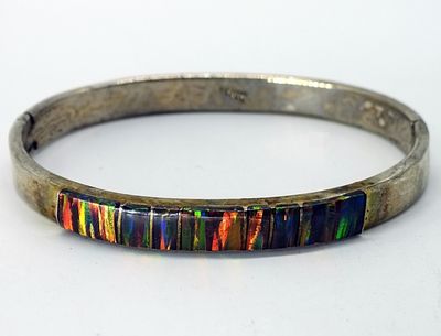 Mexico 925 Opal Inlay Hinged Bangle. Sterling silver hinged bangle featuring vibrant channel-set 