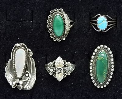 5 Sterling Silver Turquoise Rings. Five marked sterling silver rings featuring blue and green 