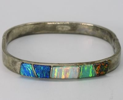 Mexican 925 Opal Inlay Bangle. Square hinged bangle marked "Mexico 925" featuring five 