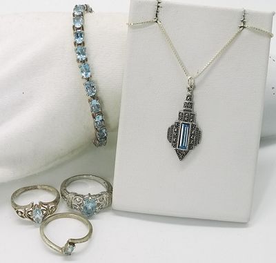 Sterling Blue Topaz Jewelry Set. Five-piece blue topaz set in marked sterling silver including 