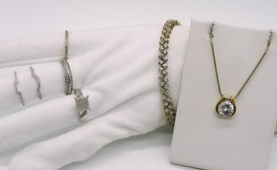 Sterling Simulated Diamond Jewelry (7 pieces). Collection includes five sterling silver rings 
