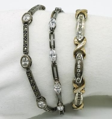 3 Sterling Simulated Diamond Bracelets. Set of three sterling silver bracelets featuring 