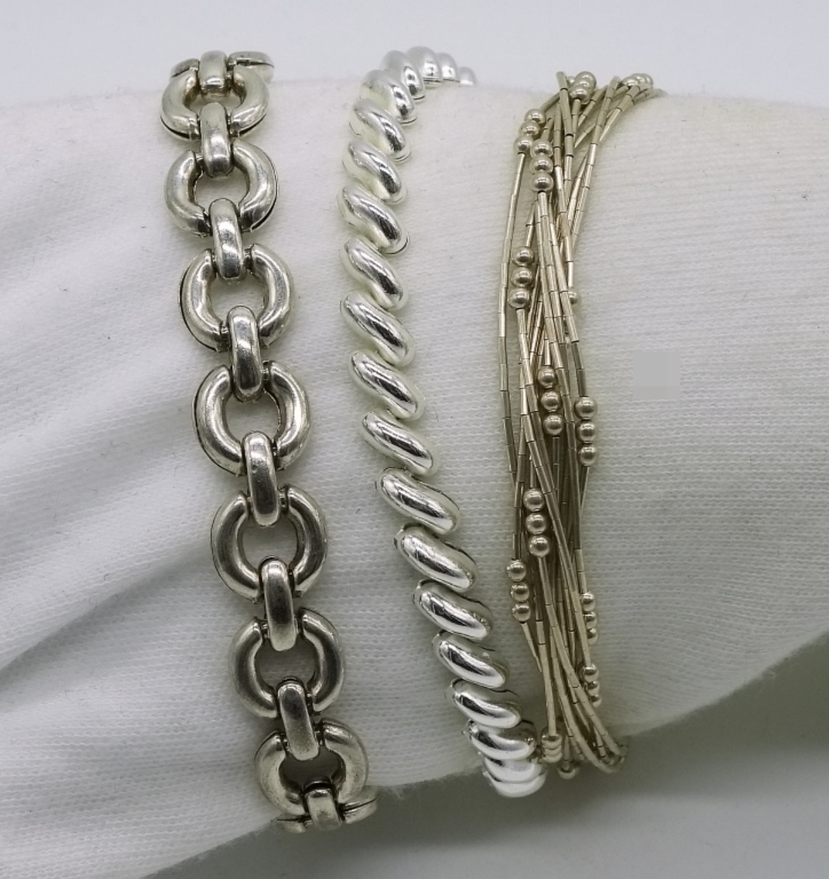 Three Sterling Silver Bracelets, 7" Each