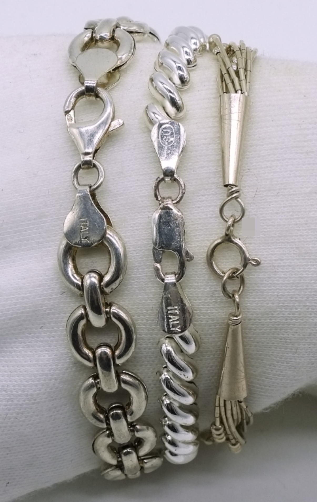 Three Sterling Silver Bracelets, 7" Each