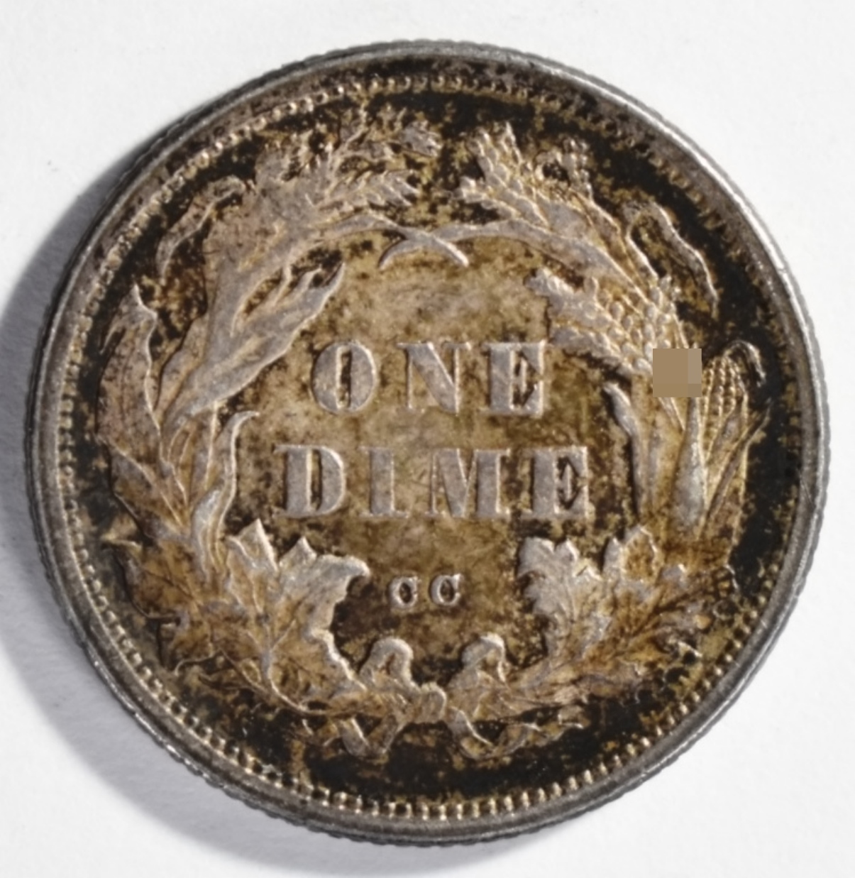 1875-CC Seated Dime CC Above Bow