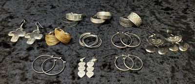 Costume Earring Lot, 11 Pairs. A grouping of 11 sets of mixed-tone costume earrings, including 