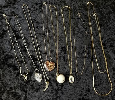Costume Necklace Lot, 9 Pieces. A mixed estate lot of nine costume necklaces in silver-tone and 