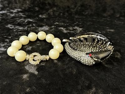 Bracelet Duo, Faux Pearl & Bird Cuff. Lot of two costume bracelets: a stretch bracelet of large 