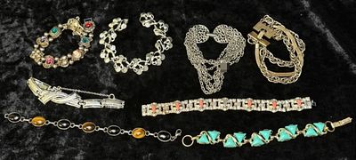 Silver Toned Bracelets, 8. 8 costume bracelets in mixed tones, offering pops of color across the 