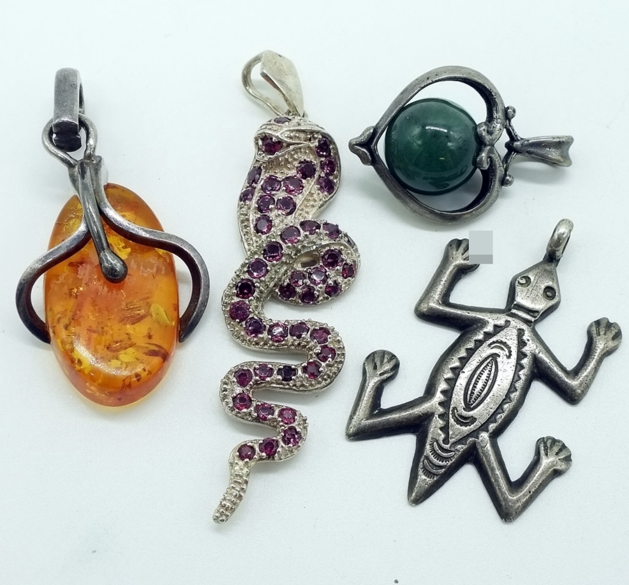 Four Sterling Pendants