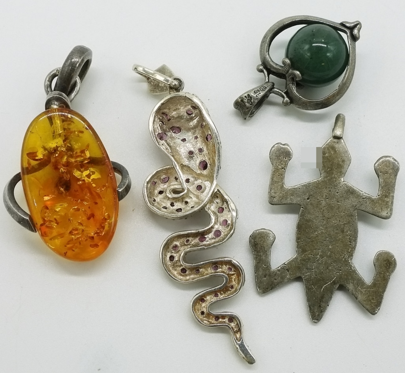 Four Sterling Pendants