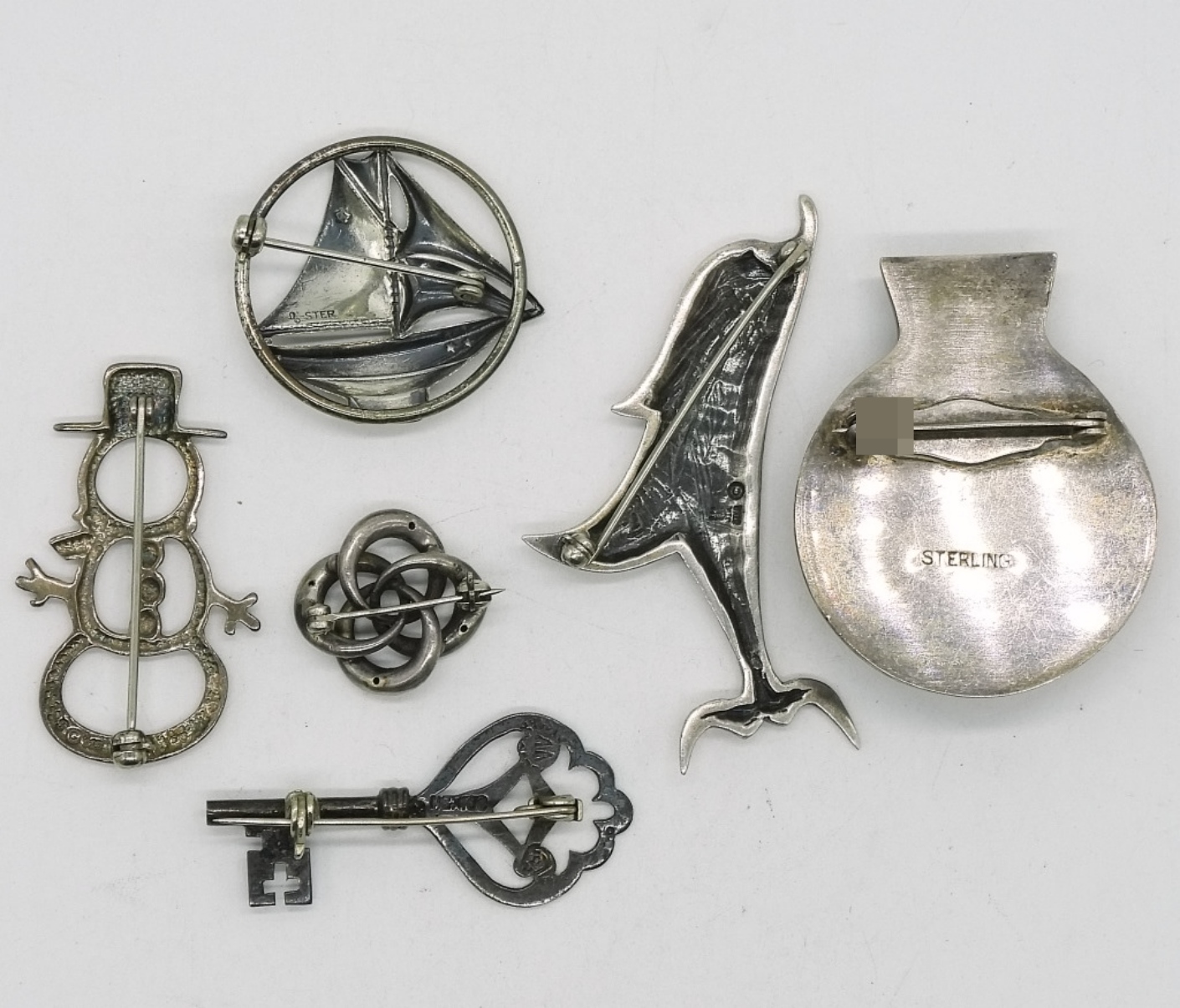 Six Sterling Brooches
