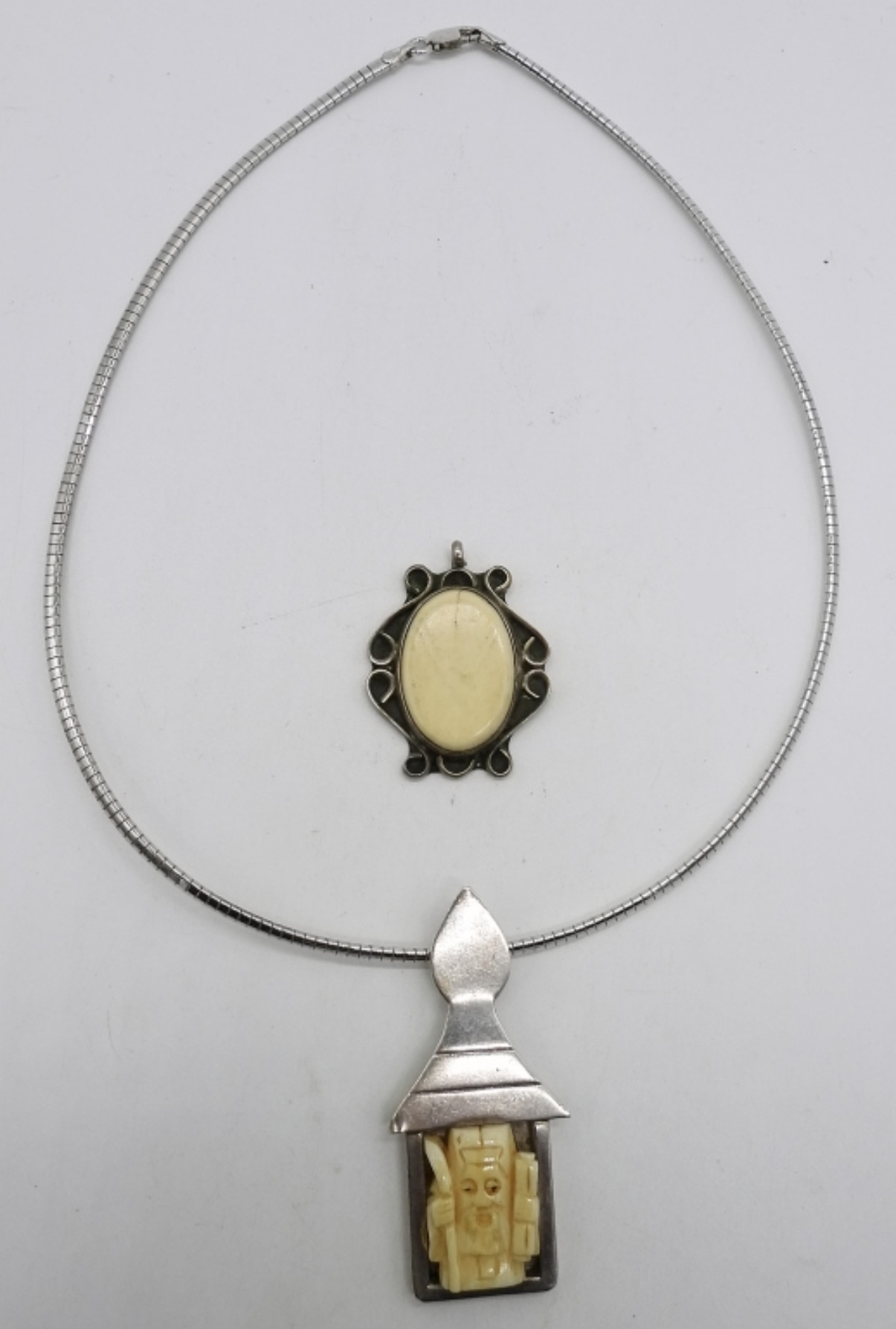 Two Sterling Bone Pendants