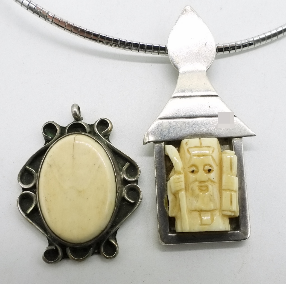 Two Sterling Bone Pendants
