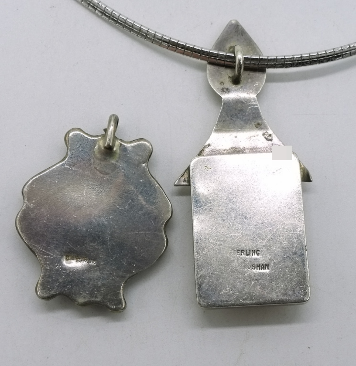 Two Sterling Bone Pendants