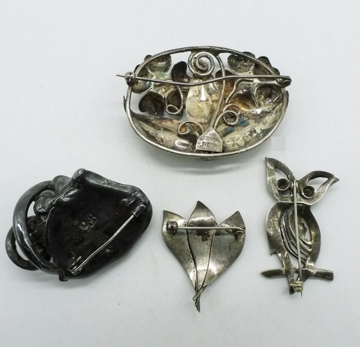 Four Sterling Brooches
