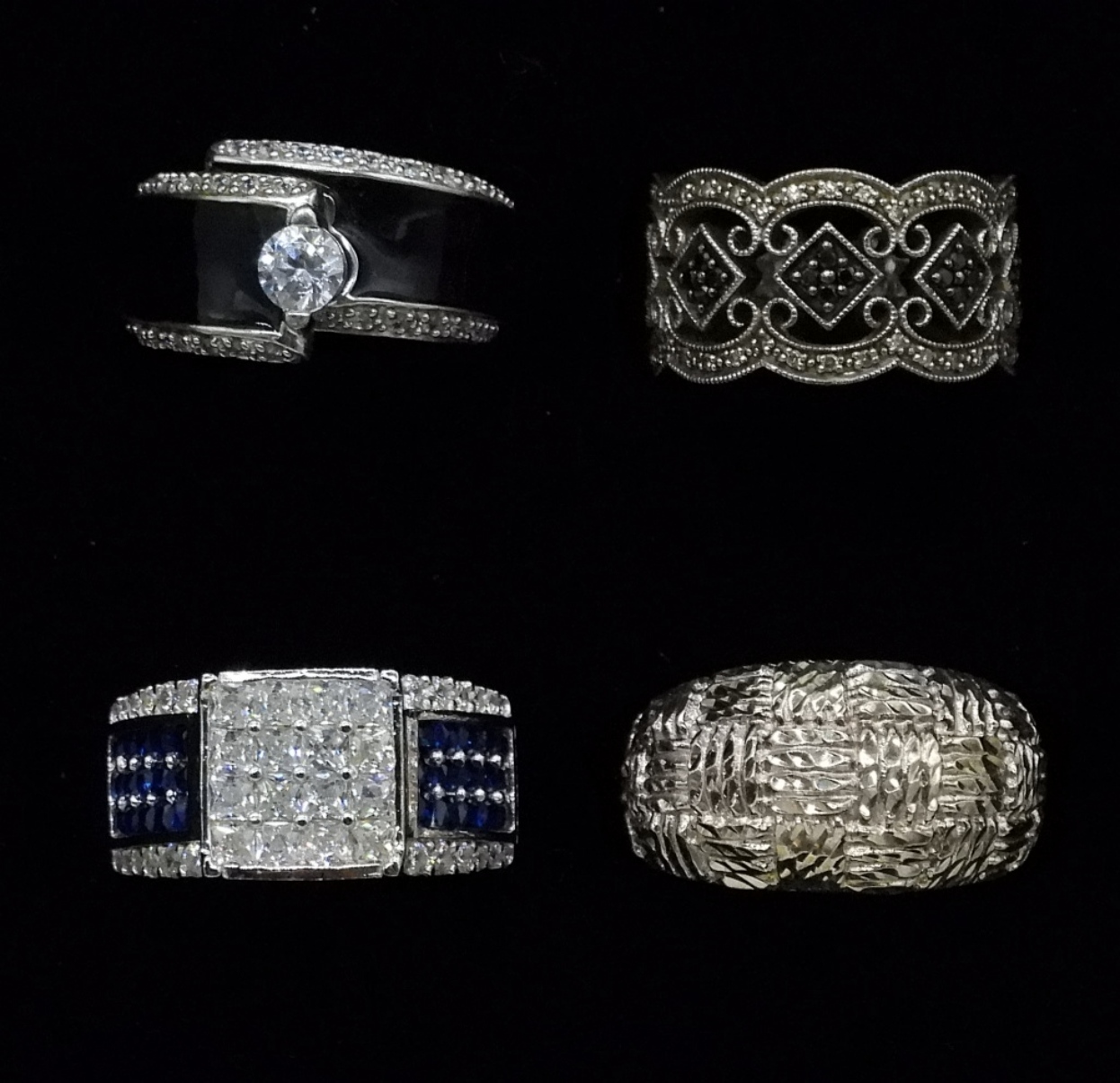 Four Sterling Rings with Gemstones