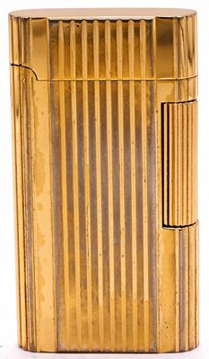 Zippo Lighter, Gold Plated Butane, Ribbed Case. This is a Zippo butane lighter with distinctive 