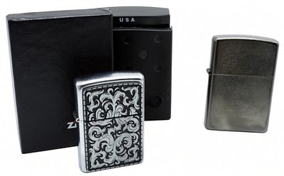 Zippo Chrome Lighters, Filigree & Brushed Finish. Two Zippo lighters featuring a chrome finish 