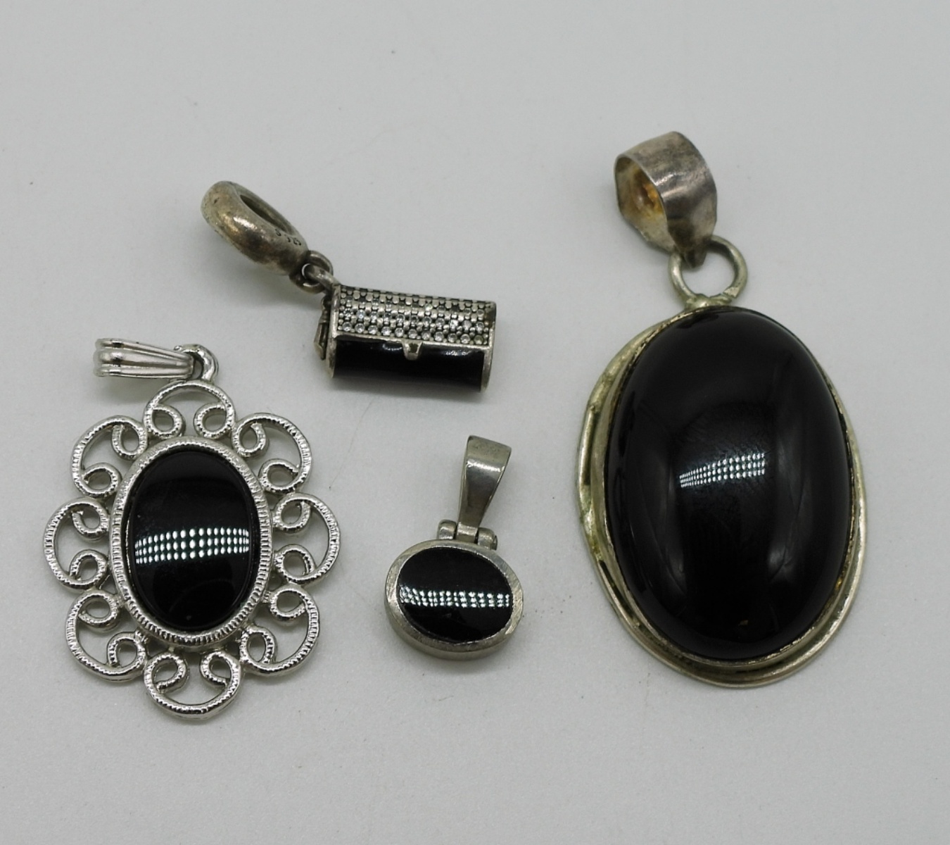 Four Sterling, Black Onyx Pendants