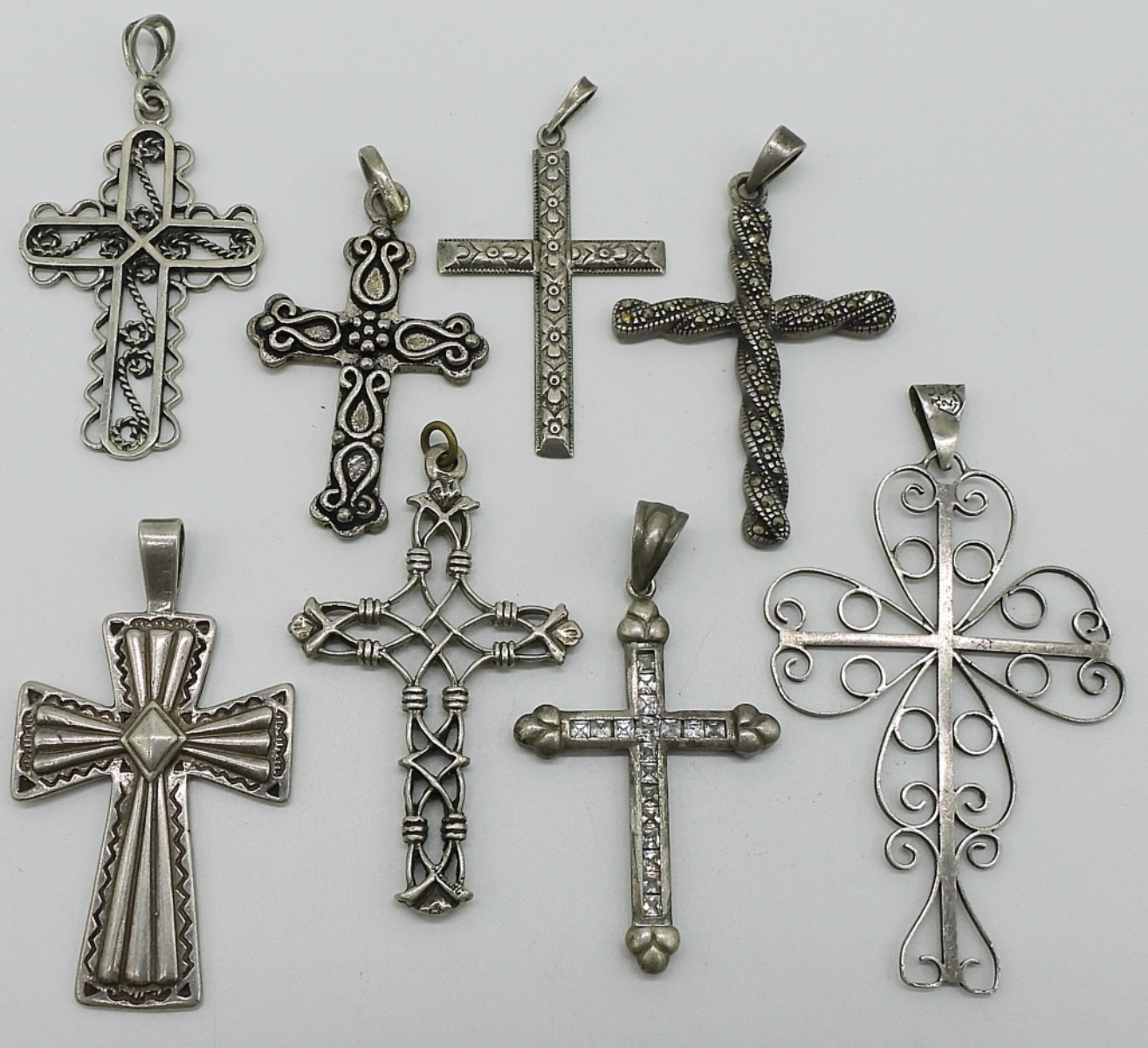 Eight Sterling Cross Pendants