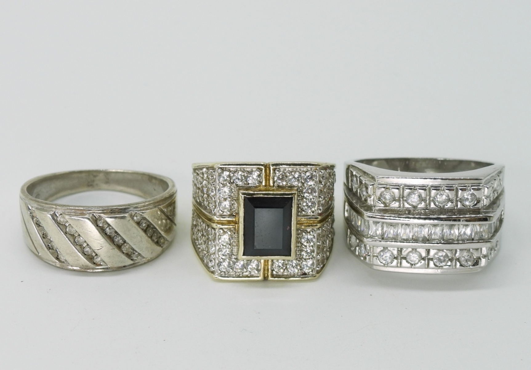 Three Sterling Rings with Clear Stones