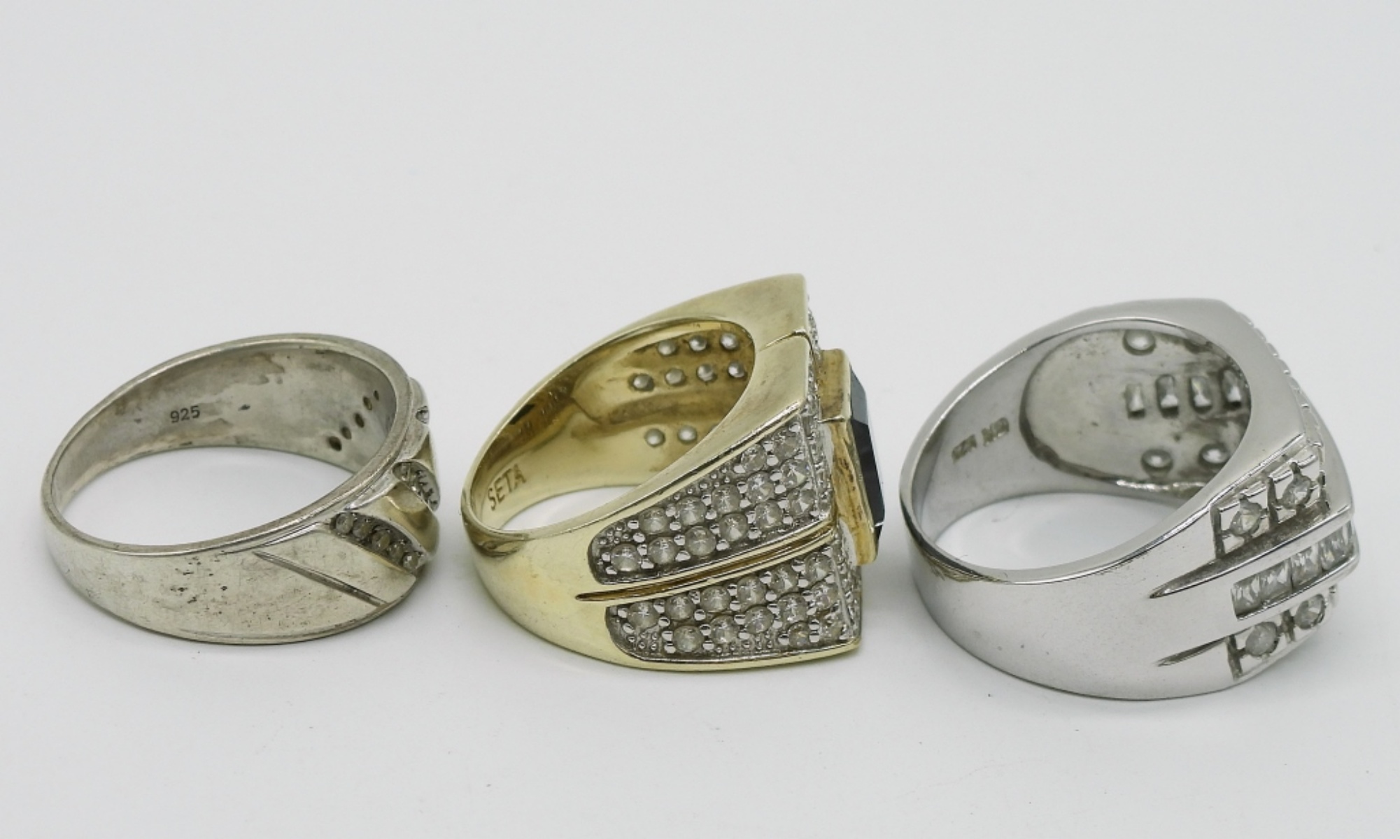 Three Sterling Rings with Clear Stones