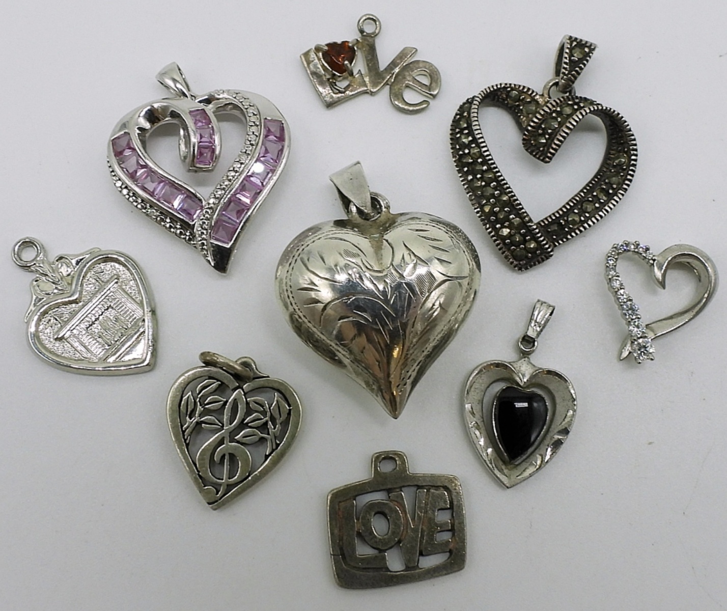 Nine Sterling Heart Pendants