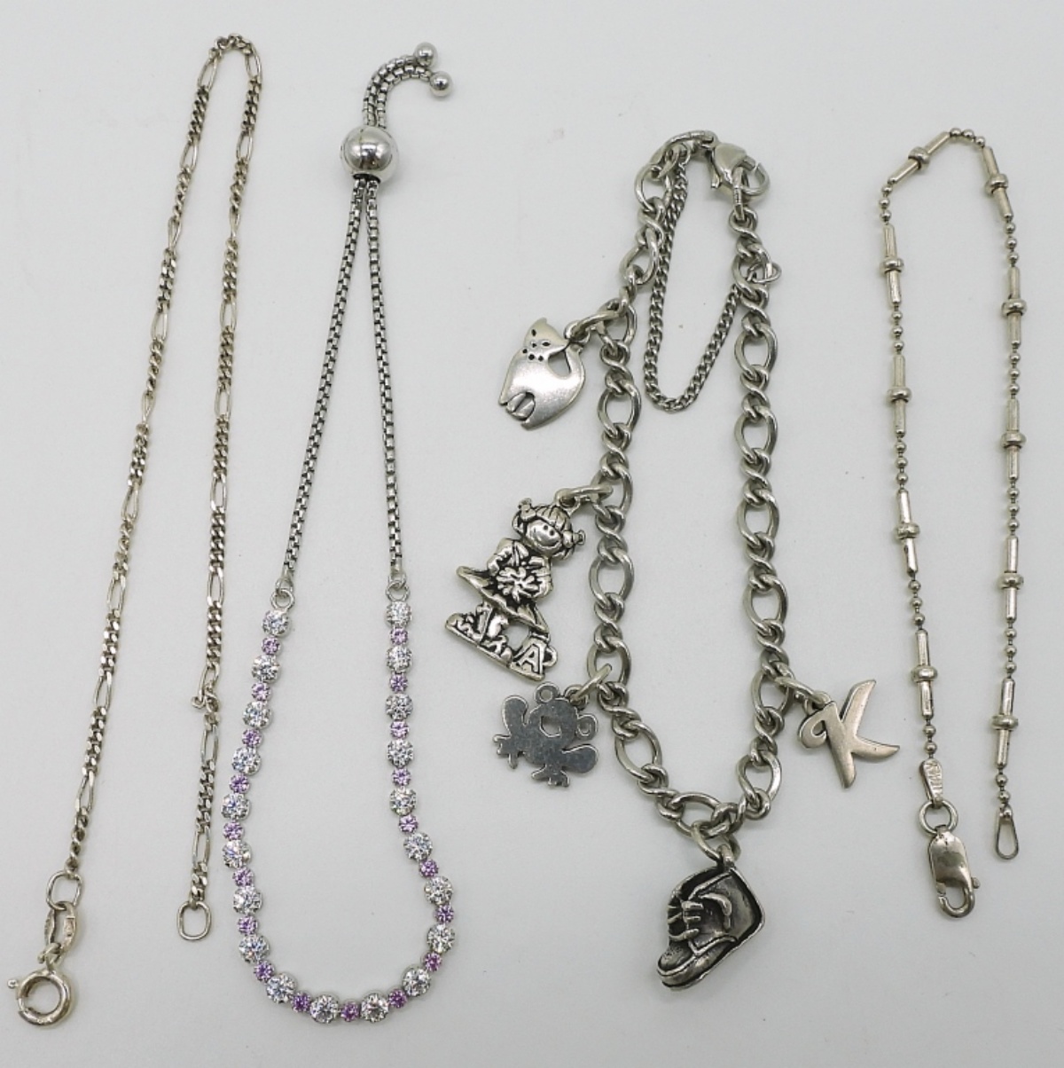 Four Sterling Bracelets / Anklet