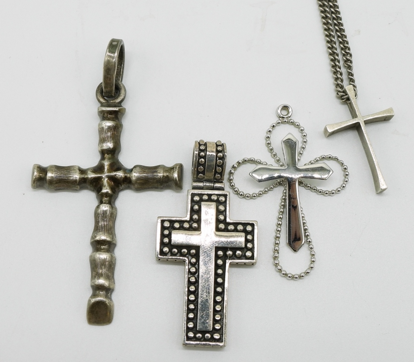 Four Sterling Cross Pendants & Chain