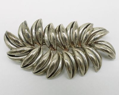 Handmade Sterling Brooch, Puka Shell Shaped. Handmade sterling brooch, puka shaped and marked 