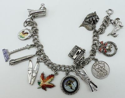 Vintage 925 Charm Bracelet, 13 Charms. Vintage sterling charm bracelet with 13 charms. 7" long. 