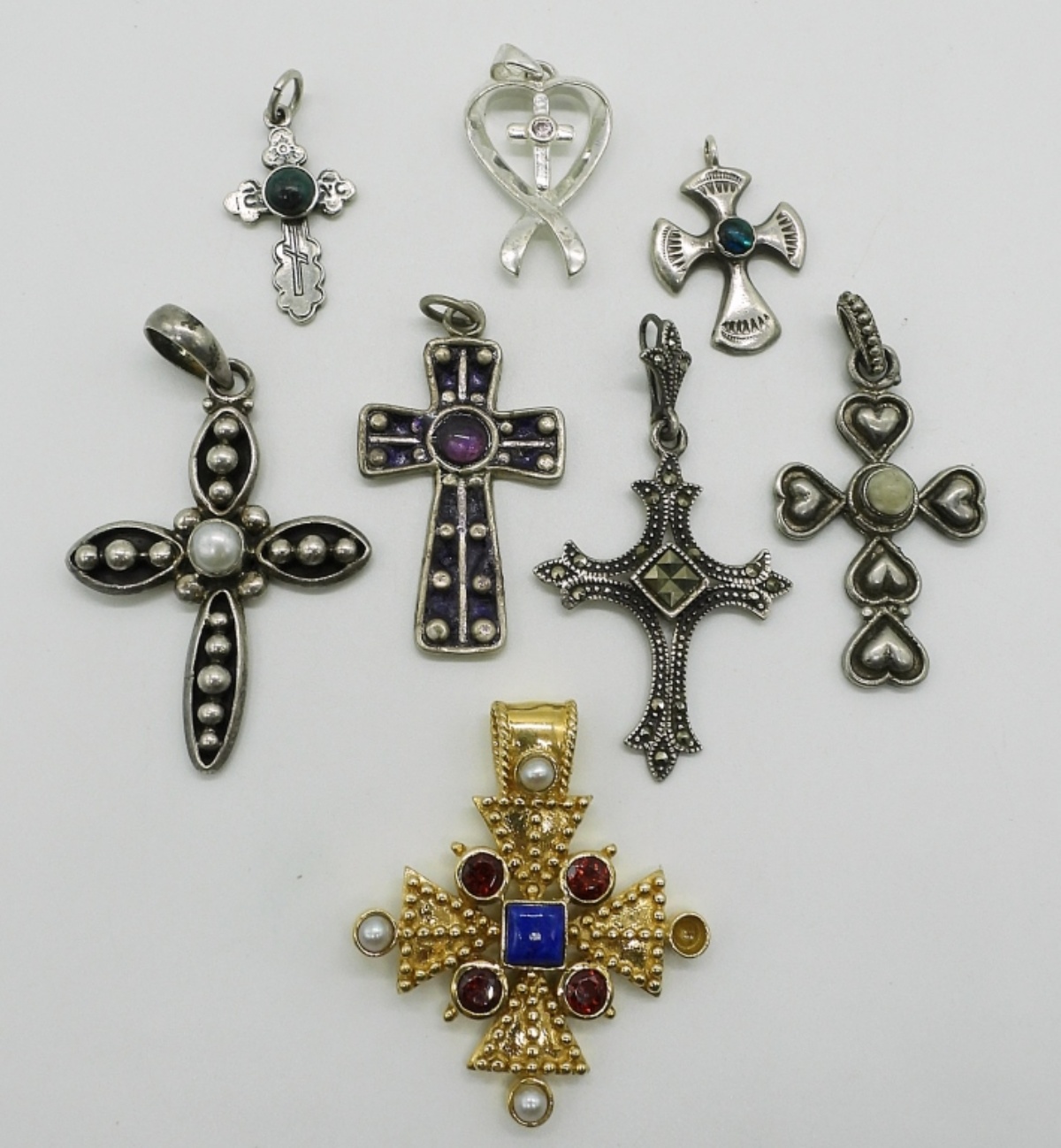Eight Sterling Cross Pendants