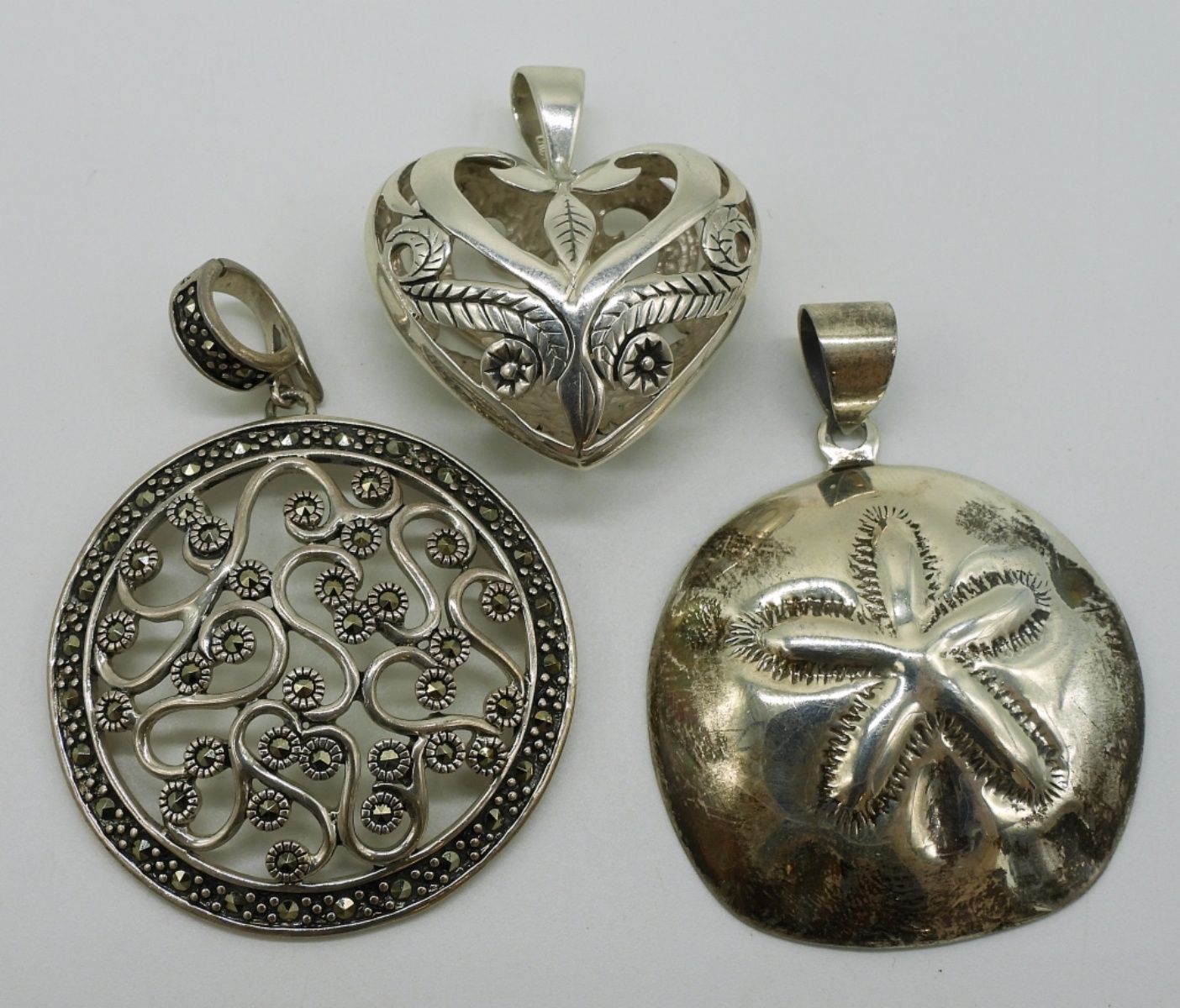 Three Sterling Fashion Pendants