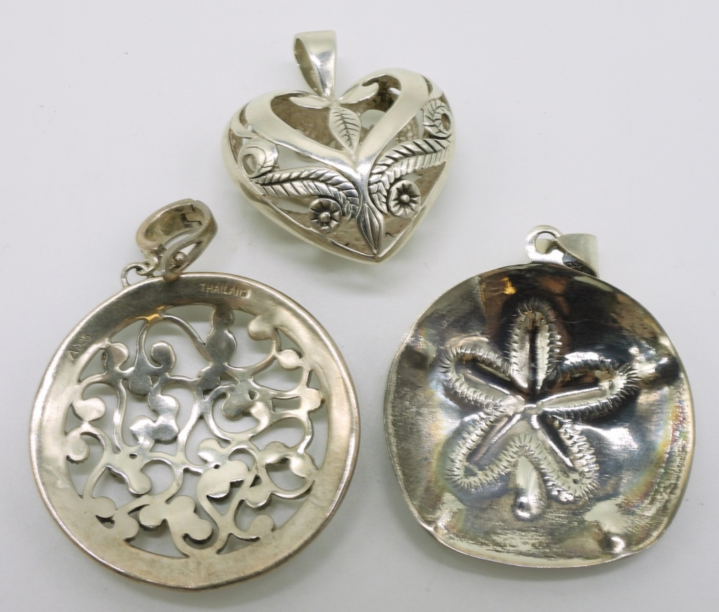 Three Sterling Fashion Pendants