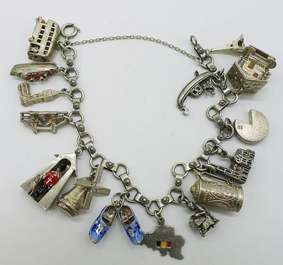 800 & 900 Silver Charm Bracelet. 800 & 900 Silver Charm bracelet and 15 charms. 8 inches long. 32 DWT
