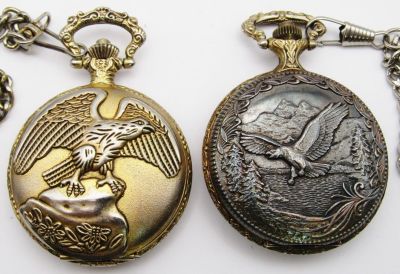 (2) EAGLE CASE QUARTZ POCKET WATCHES. with CHAINS -NEEDS BATTERIES - UNTESTED