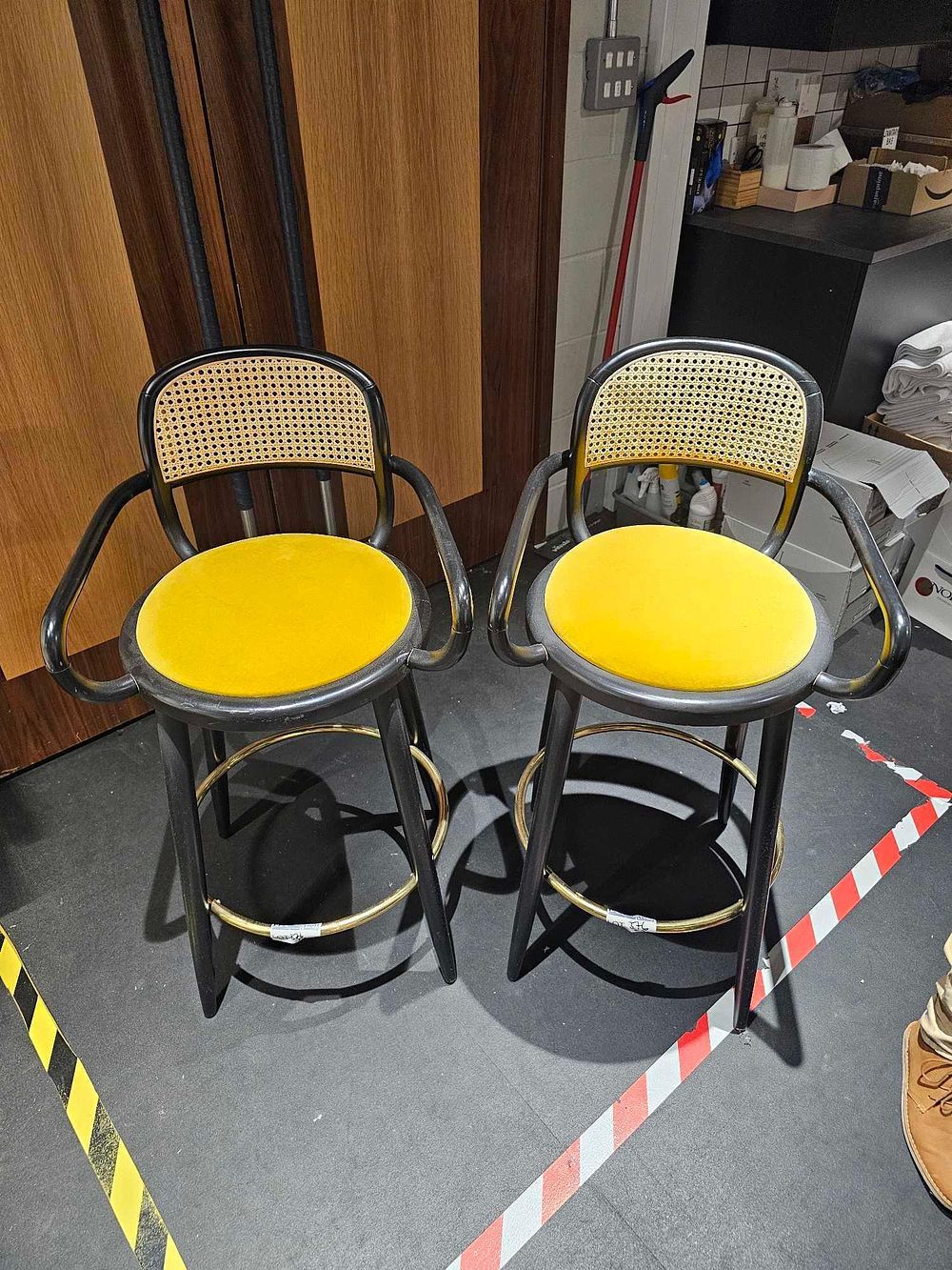 Lot 376: * A pair of De Frae Luc barstool has a solid wooden frame with a upholstered seat and cane back 50 x