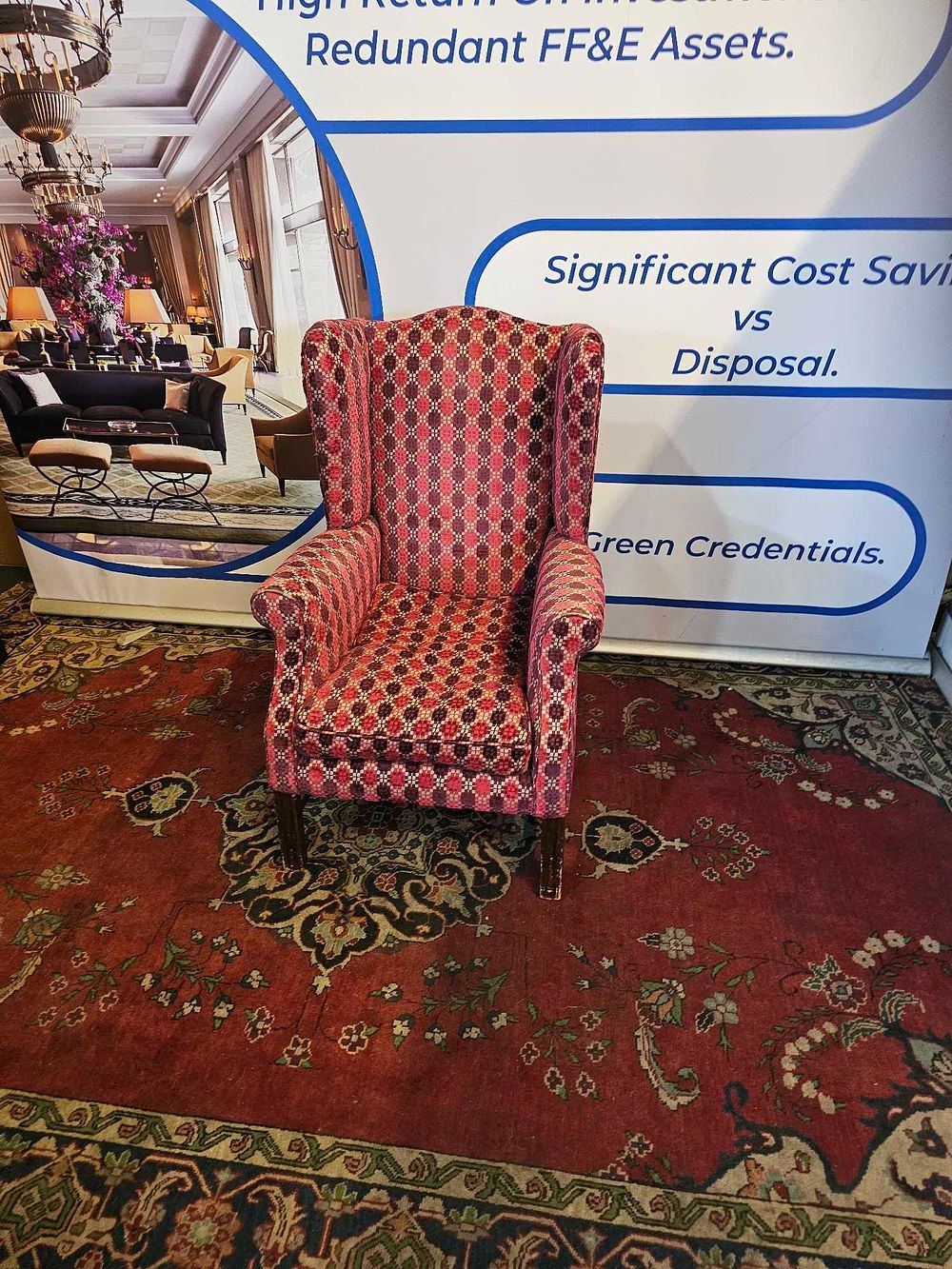 Lot 628: * A Statement Wingback Armchair in Geometric Print