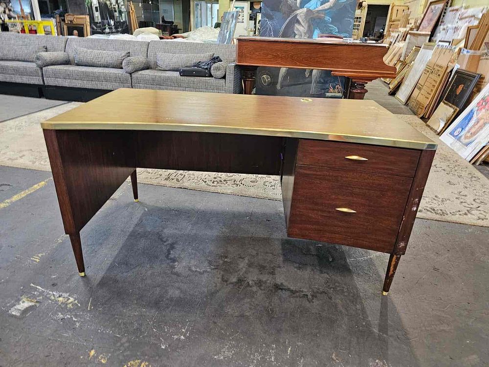 Lot 275: * Julian Chichester desk mahogany concave topped with brass edge trim single drawer with designer