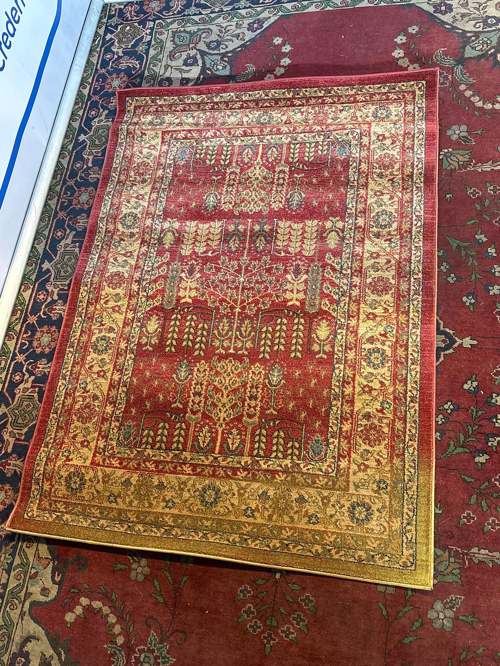Lot 367: * Windsor area rug in a red and yellow Persian-style design