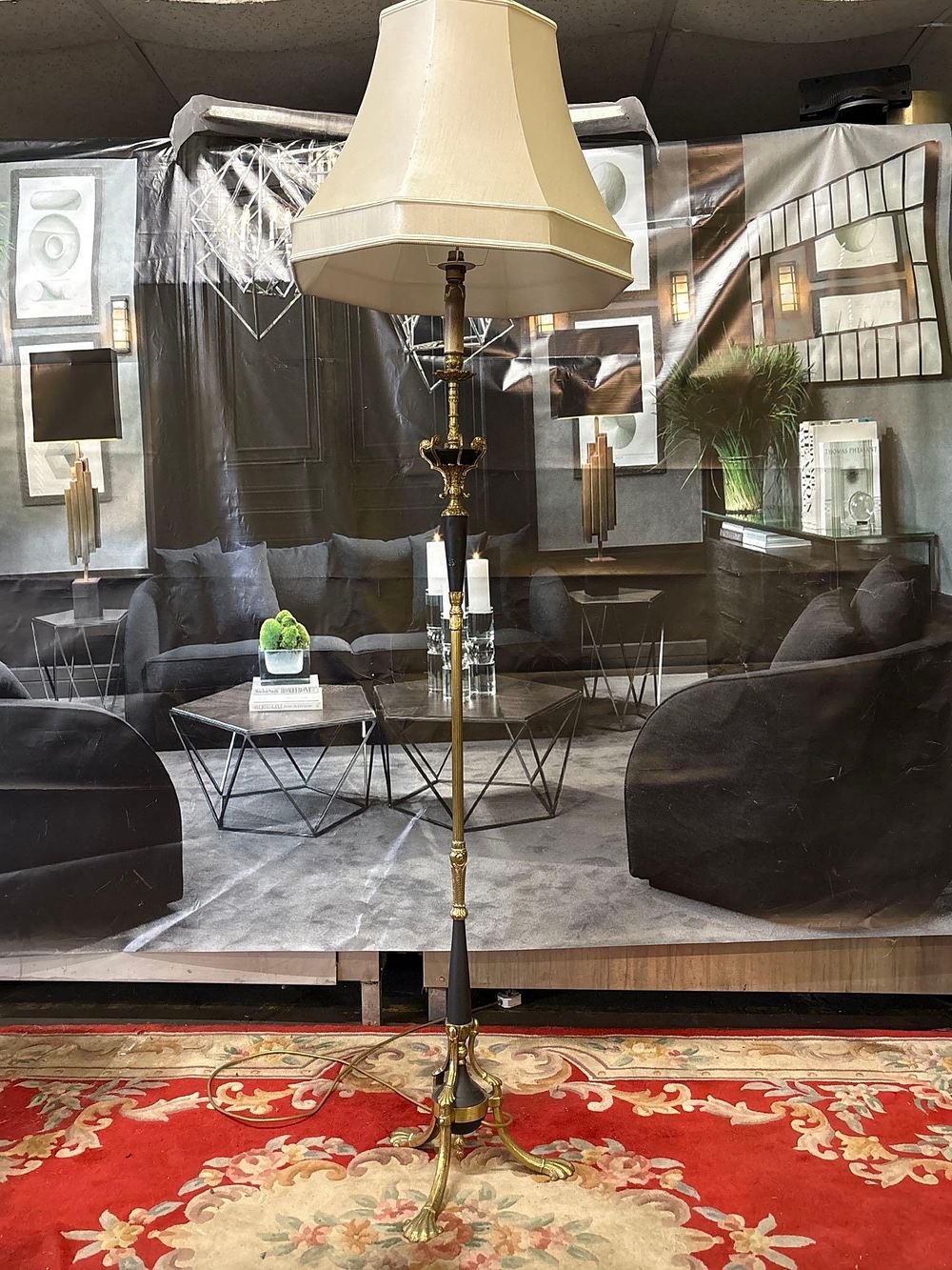 Lot 240: * Lighting Art Nouveau style brass and patinated black floor lamp stands on a tripod base with
