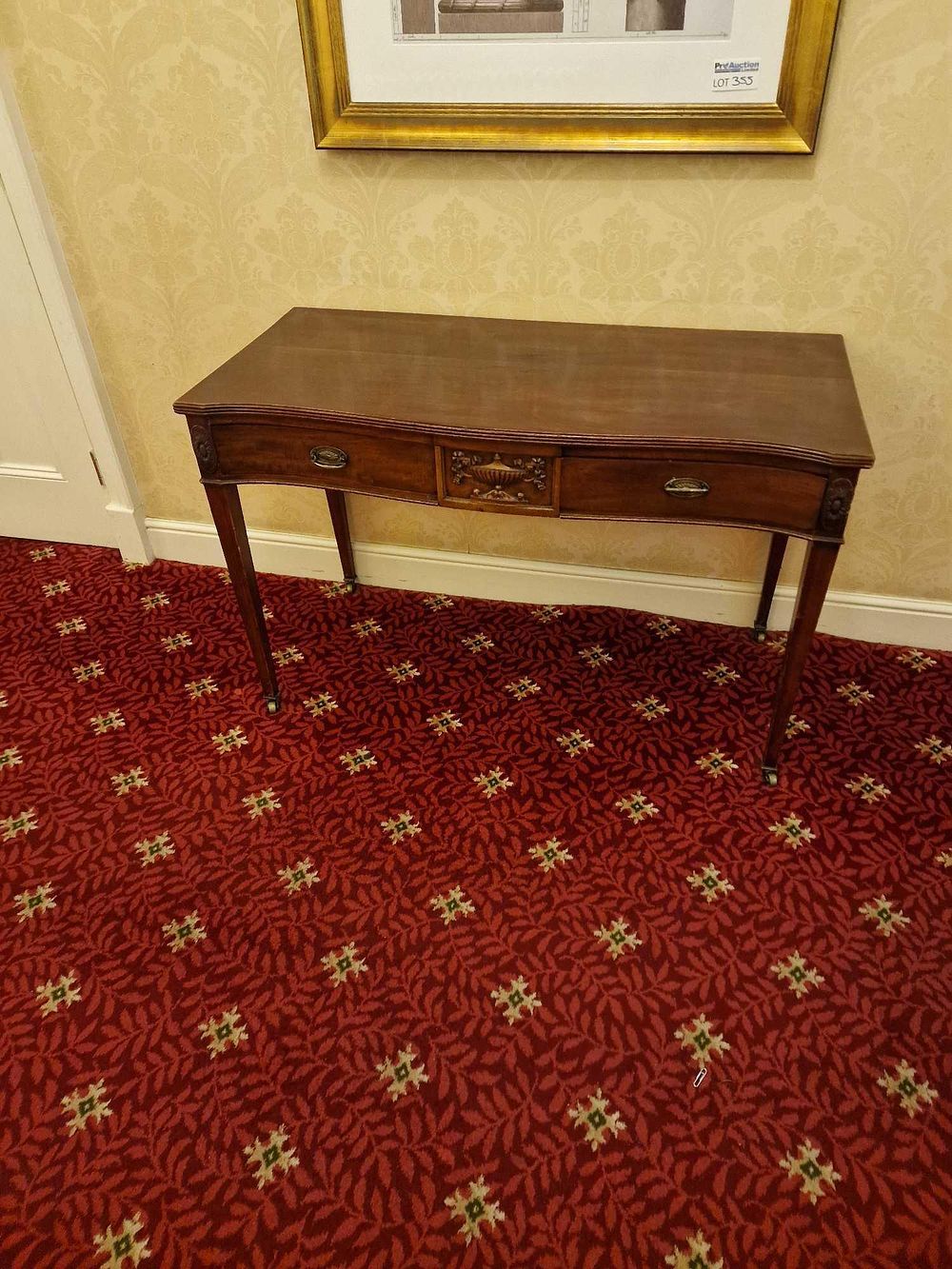 Lot 357: * An Edwardian mahogany console table