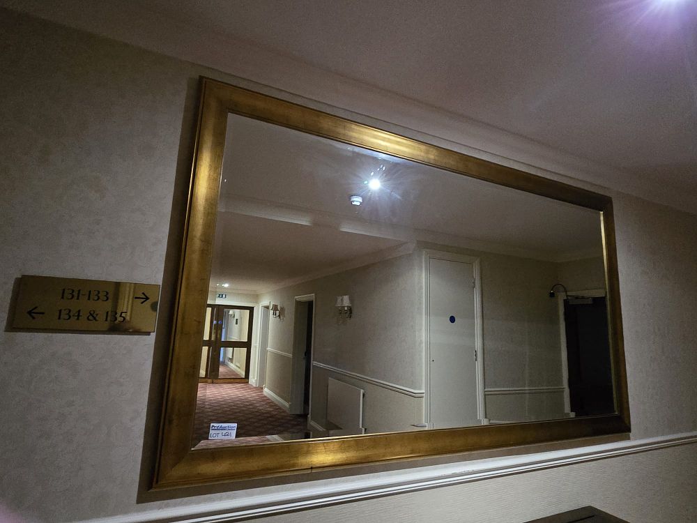 Lot 421: * A large beelled glass wall mounted mirror 236 x 136cm