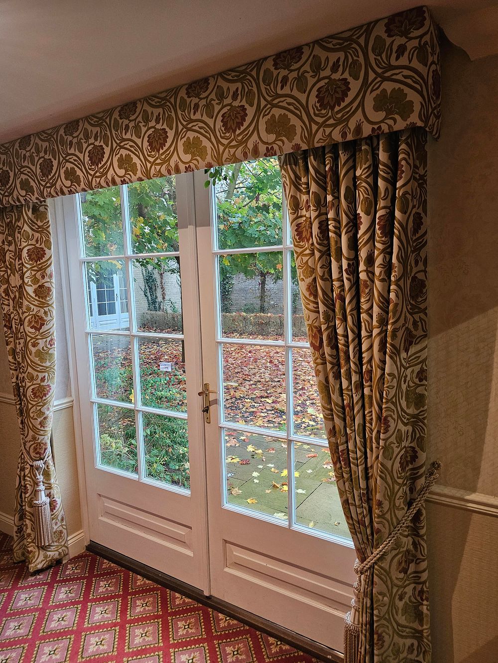Lot 493: * A pair of fully lined cotton floral fabric drapes span 210 x 240cm drop