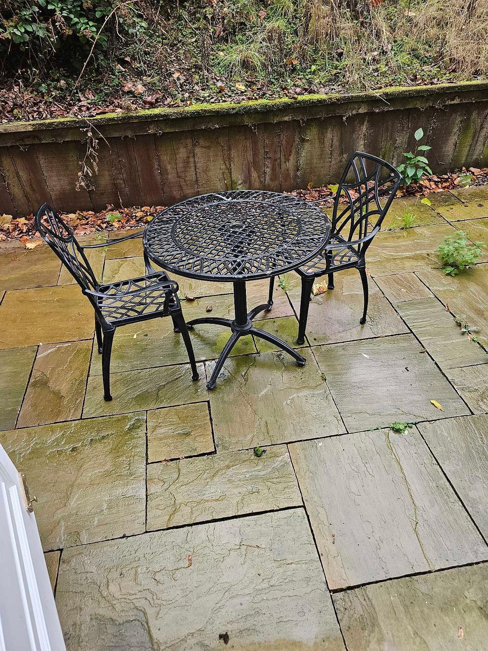 Lot 587: * A three-piece outdoor bistro set