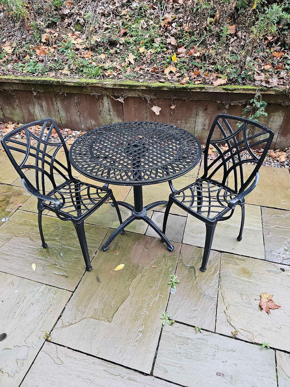 Lot 595: * A three-piece outdoor bistro set