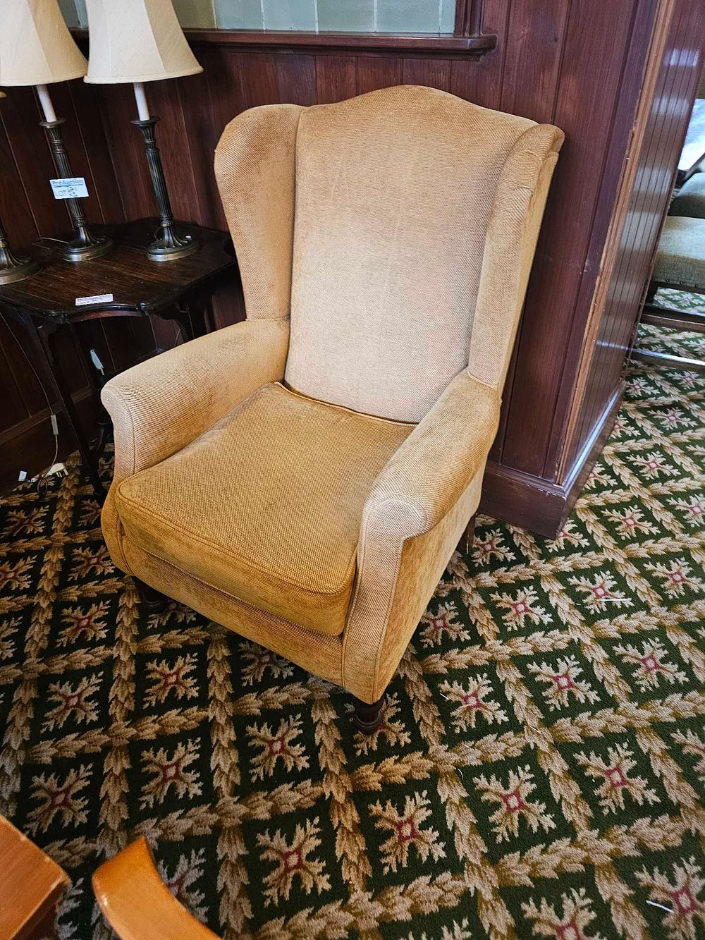 Lot 660a: * A pair of upholstered wingback armchair
